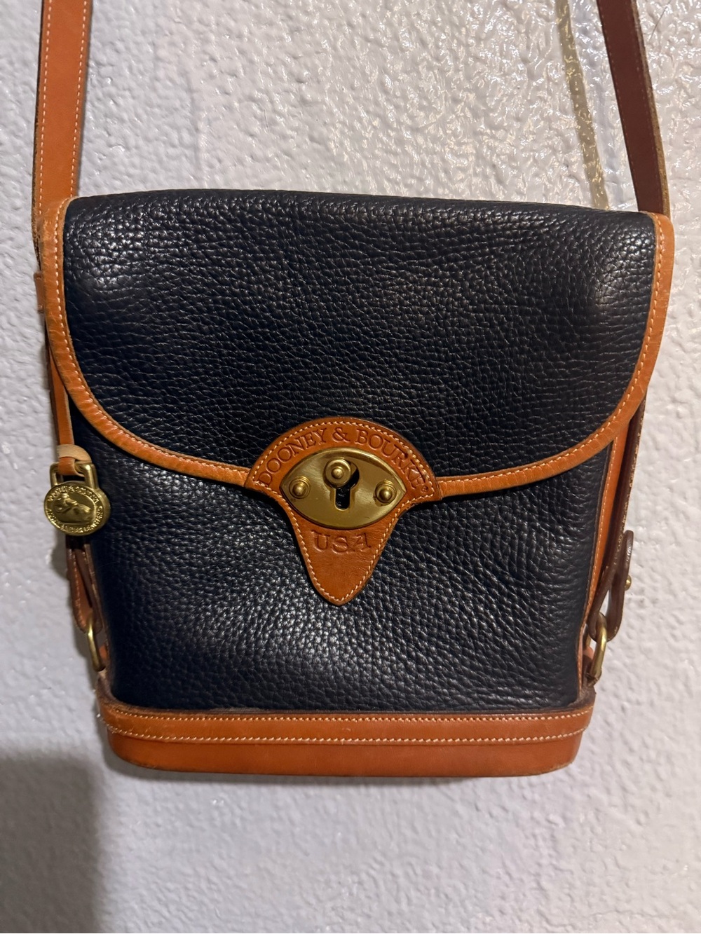 Dooney & Bourke Black with Tan Trim Pebbled Leather Messenger